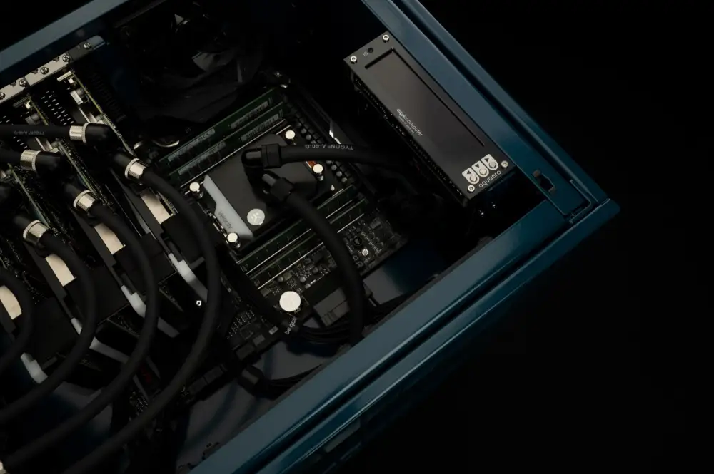 Build interior: CPU water block, loop tubing, memory banks and coolant controller in a WS.COMPUTER build